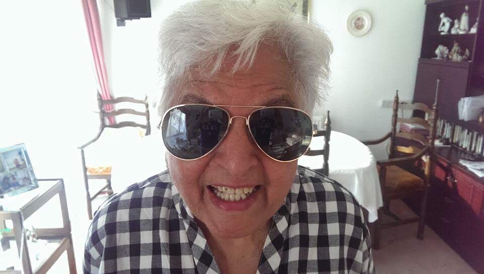 Surjit grinning in aviator sunglasses — forever cool