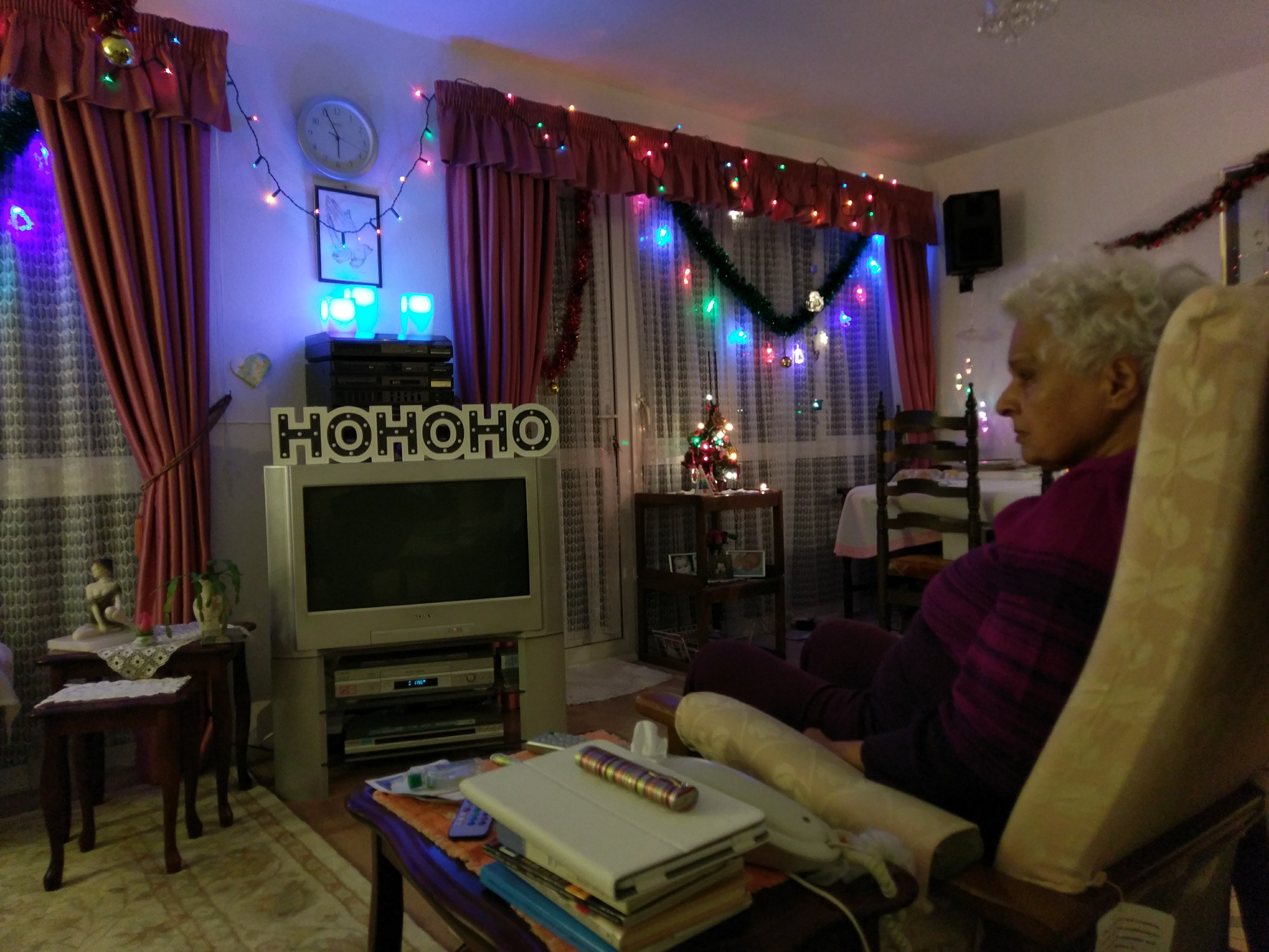 Surjit relaxing at home amongst the Christmas decorations and lights