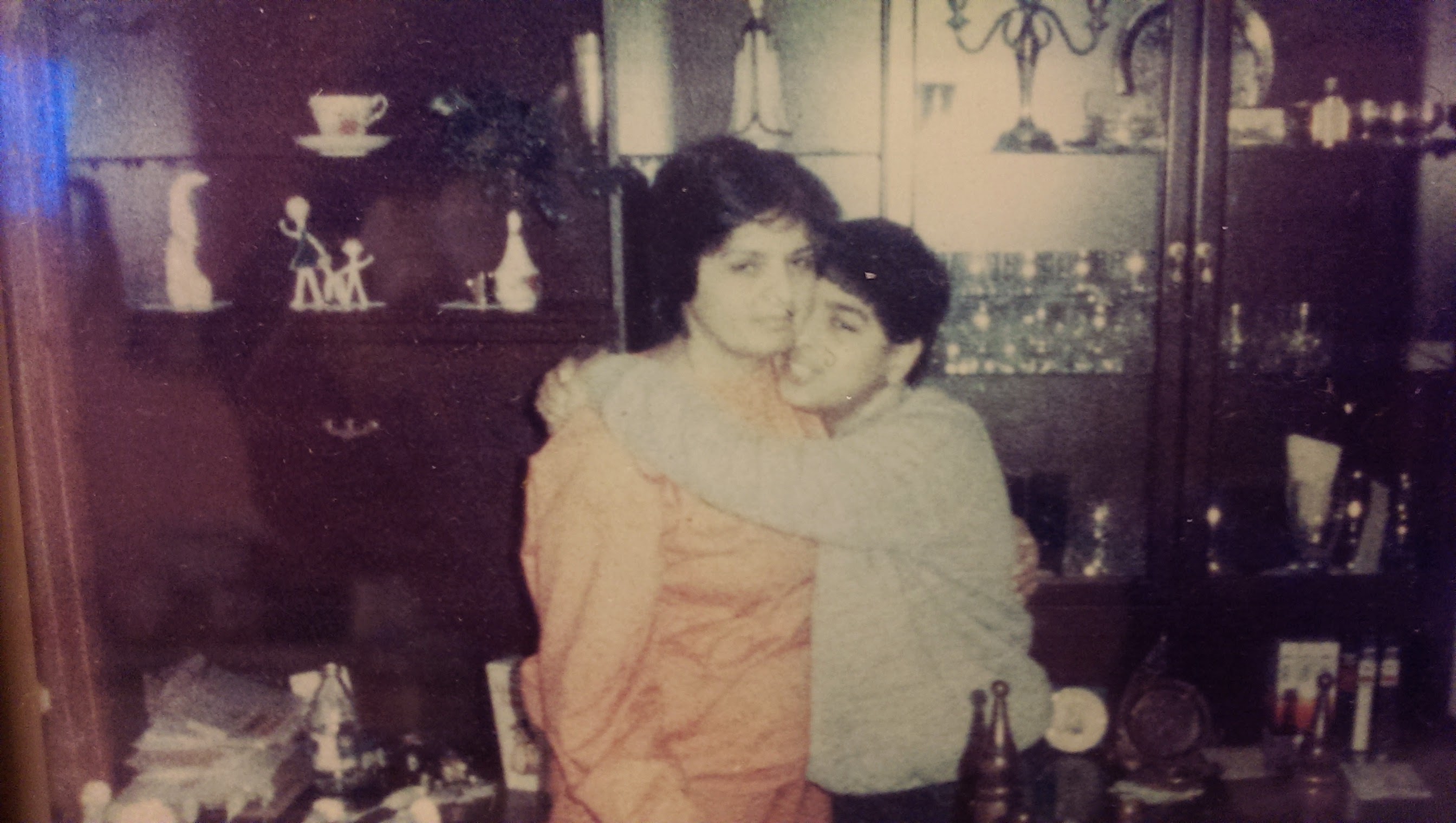 Surjit with a loved one in a warm embrace - a vintage photograph showing deep family bonds