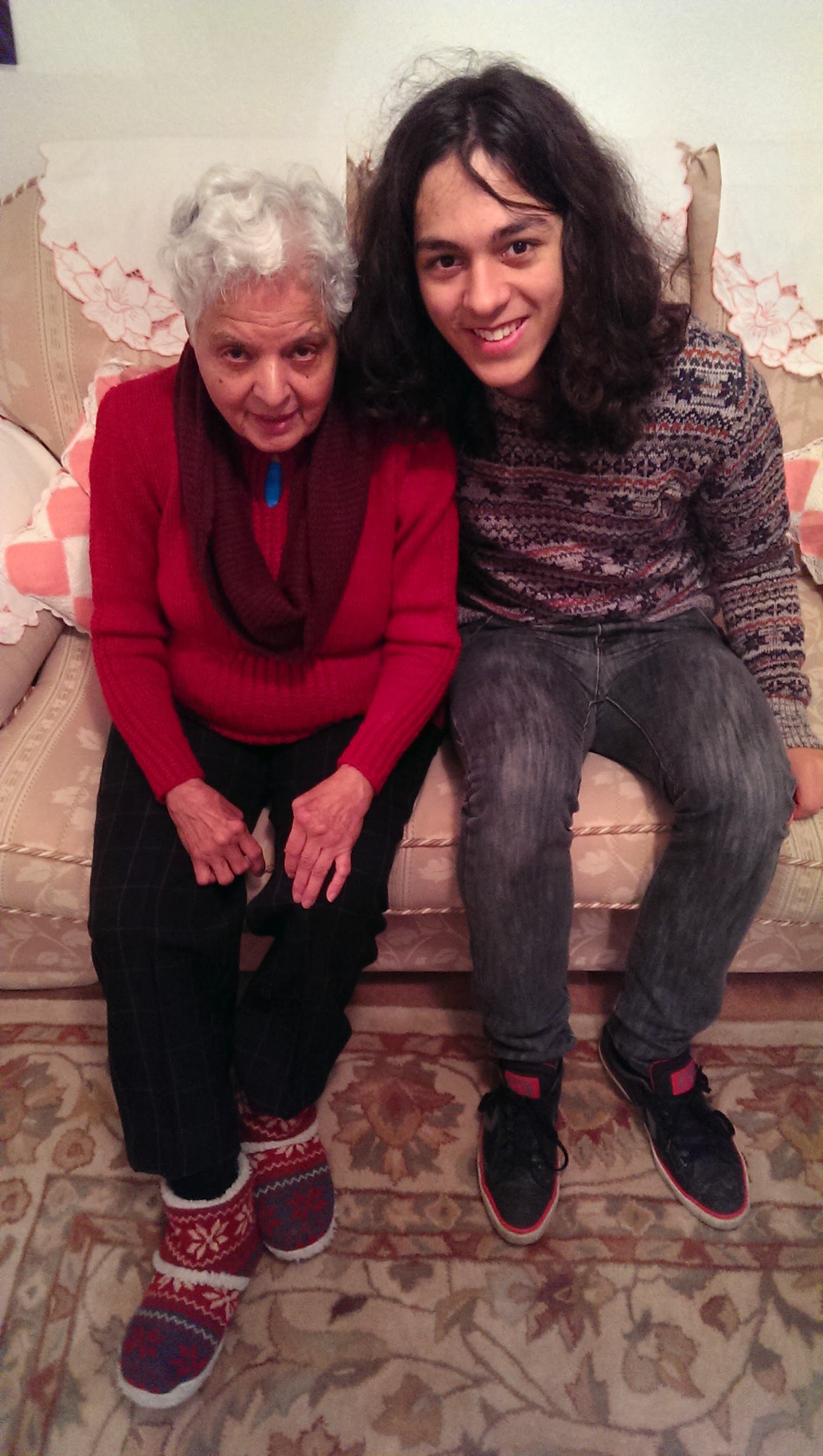 Surjit sitting with a grandchild, sharing warmth and love