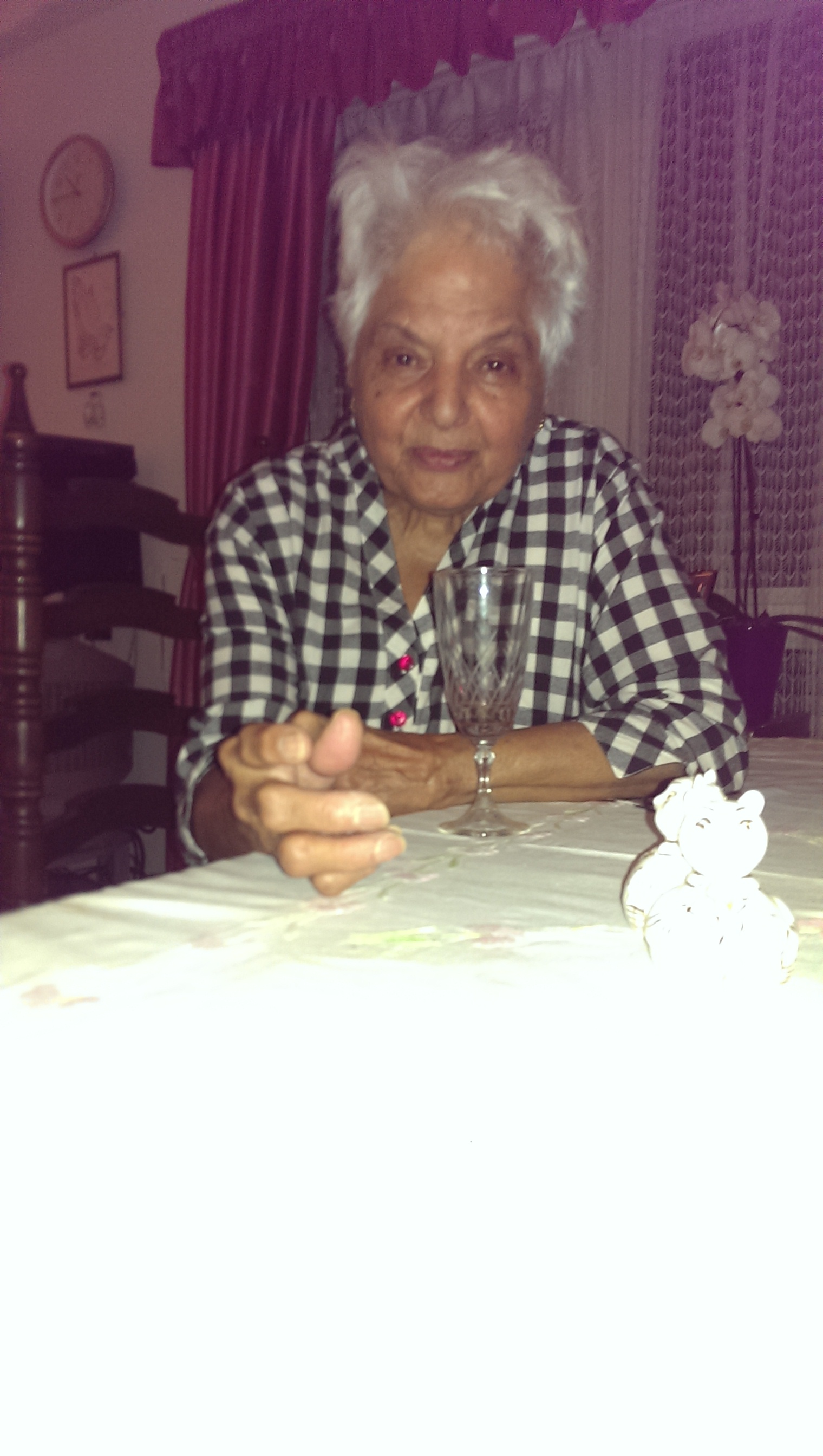 Surjit seated at the dining table, a picture of grace