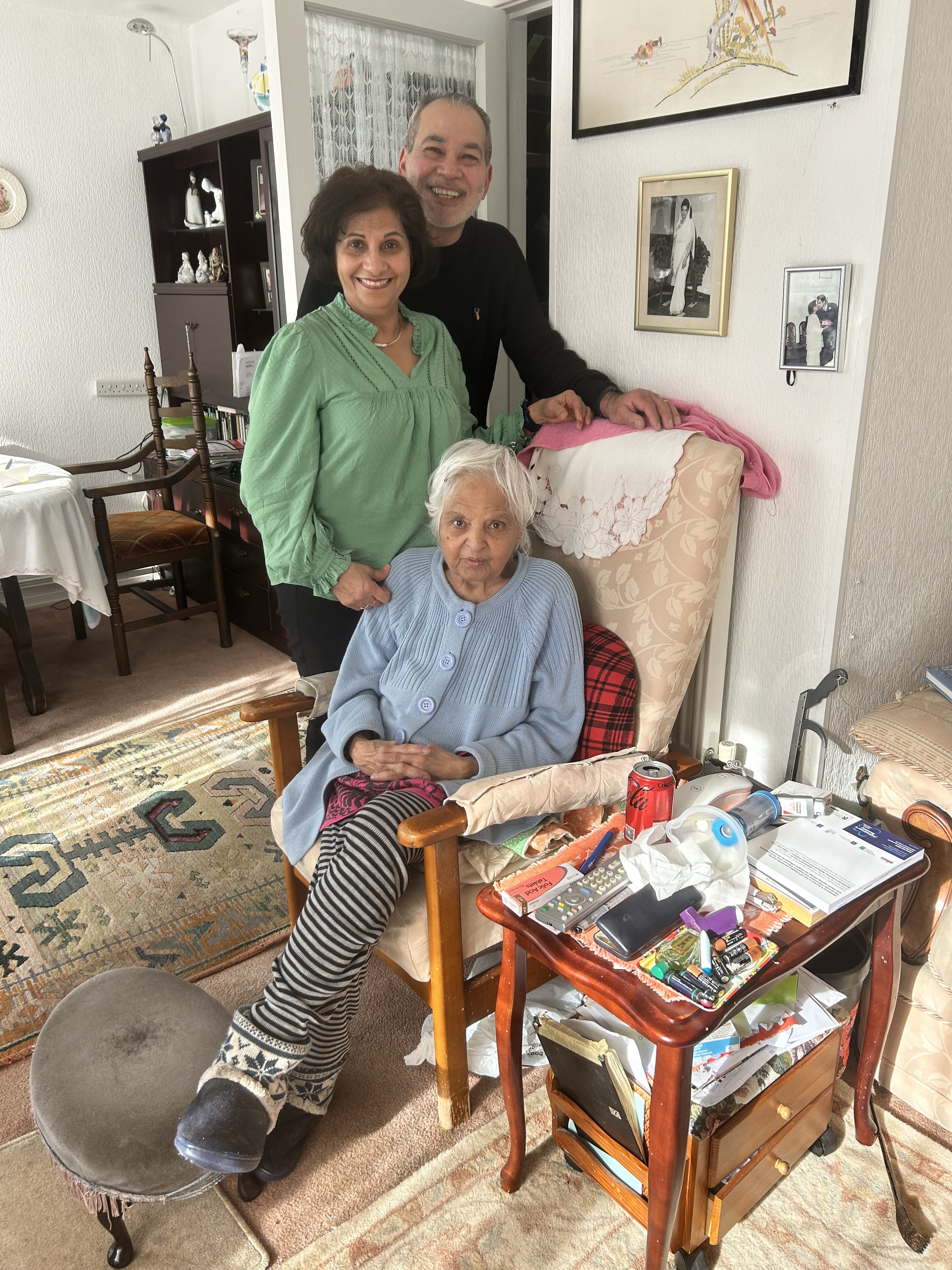 Surjit at home surrounded by visiting family and friends