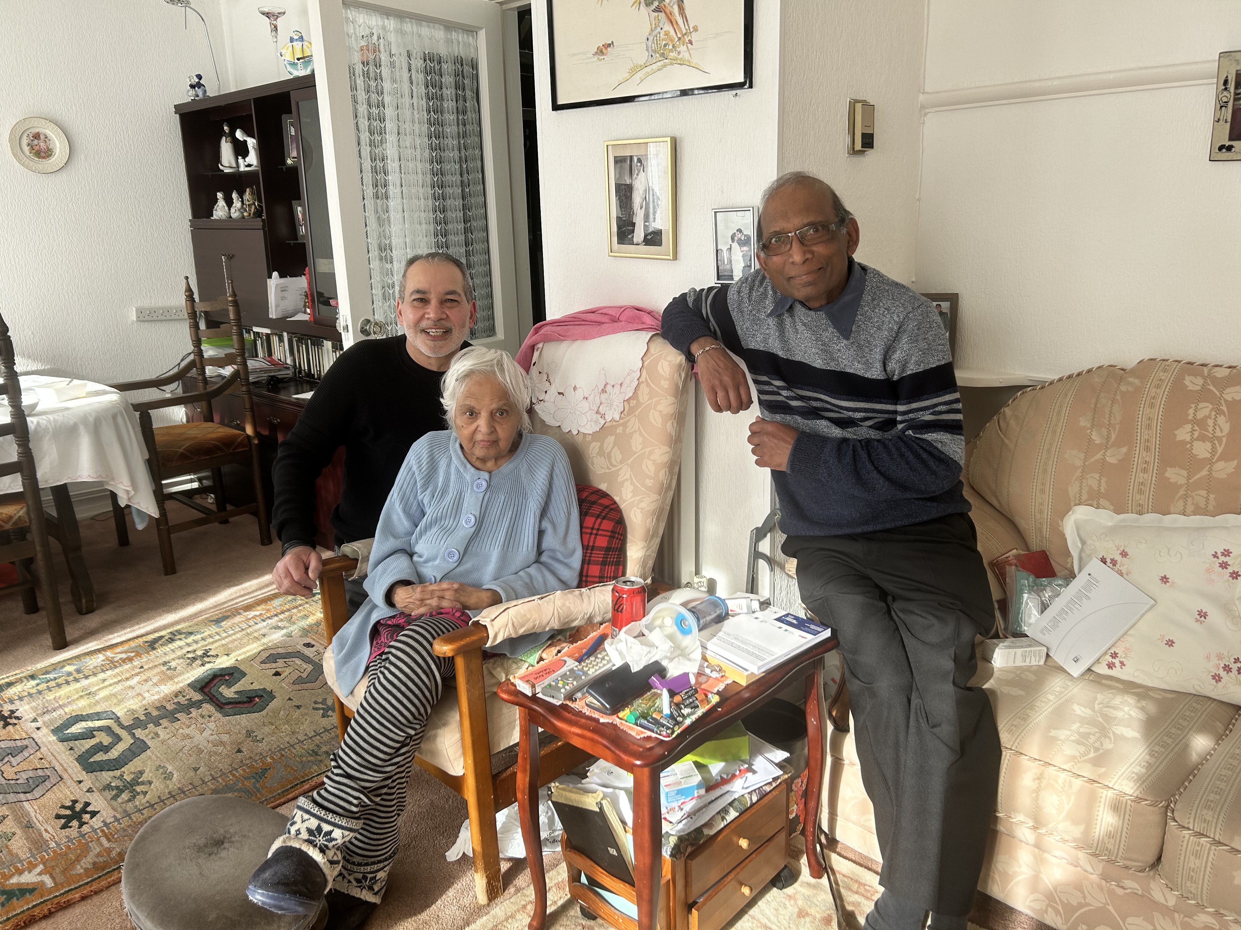 Surjit with visitors in her sitting room