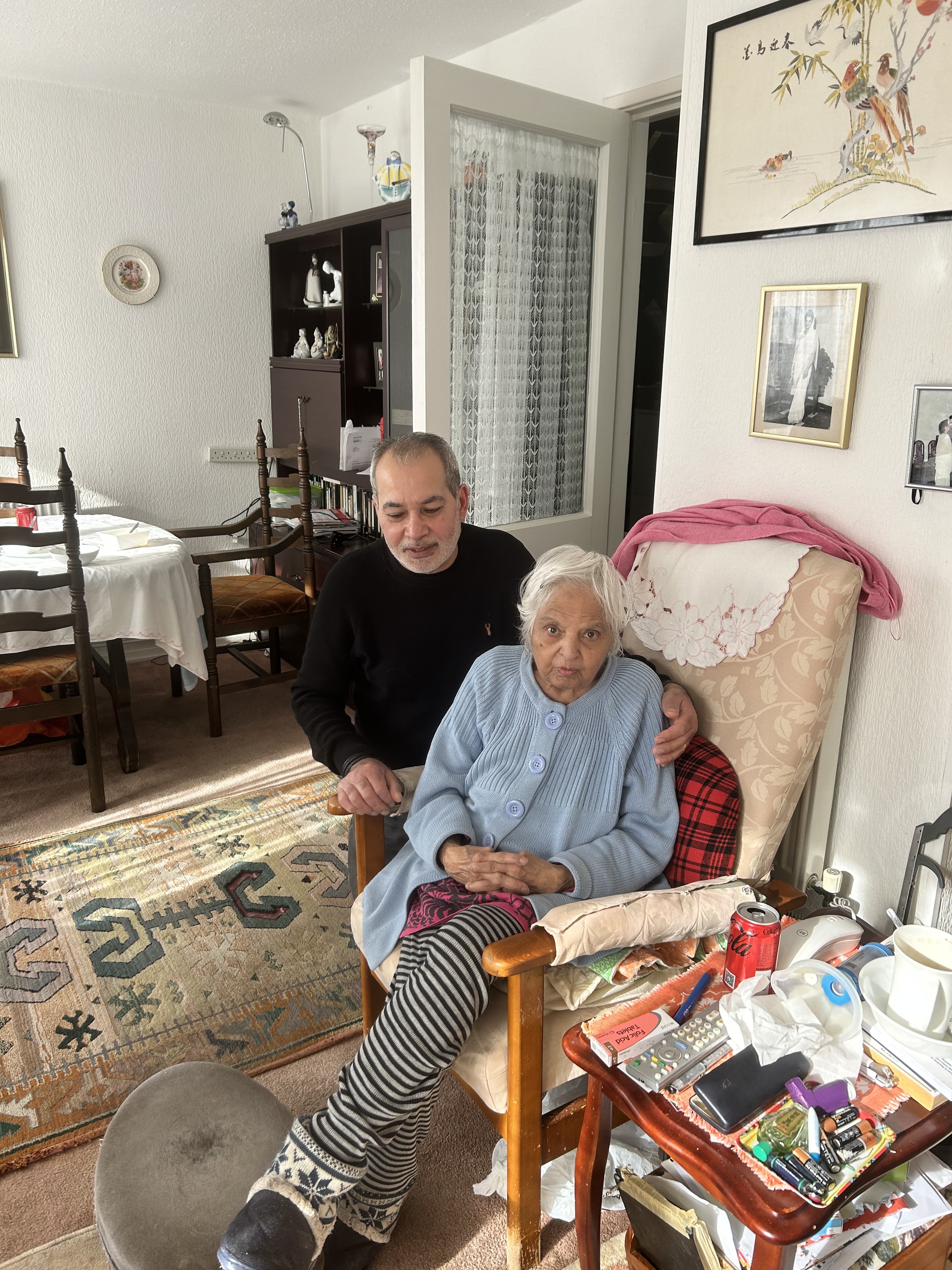 Surjit warmly greeting a loved one at home