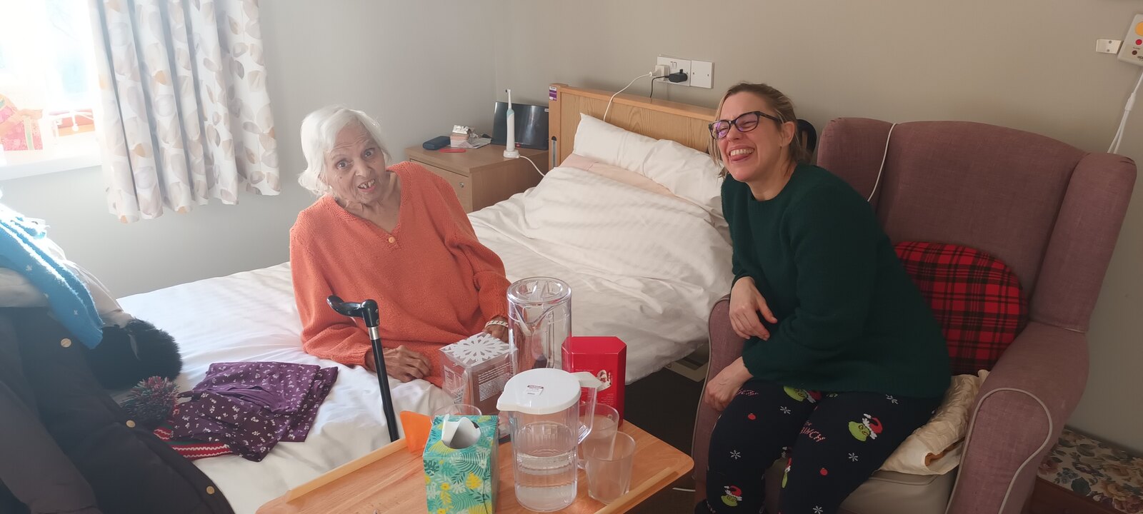 Surjit laughing together with family at Christmas 2025