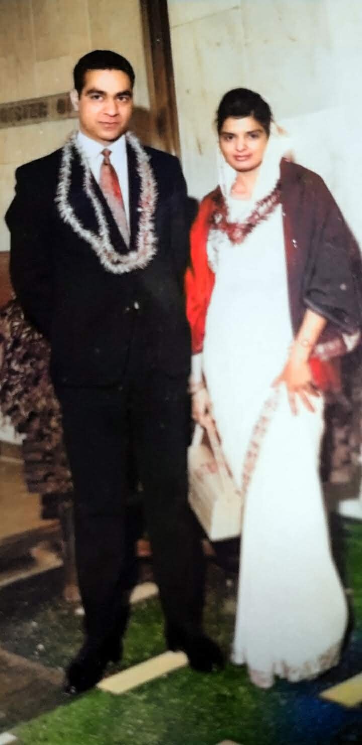 Surjit and her husband on their wedding day — a beautifully colorized photograph